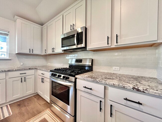 Building Photo - Inviting 4-Bed, 2.5-Bath Home with High Ceilings and Covered Deck