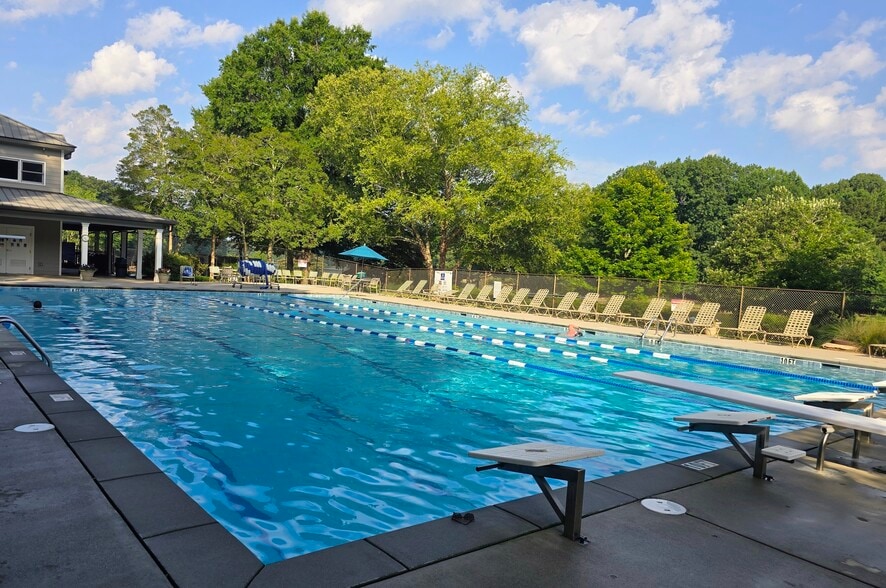 Views of the lake while swimming in the pool. - 90 Martin Point Ct