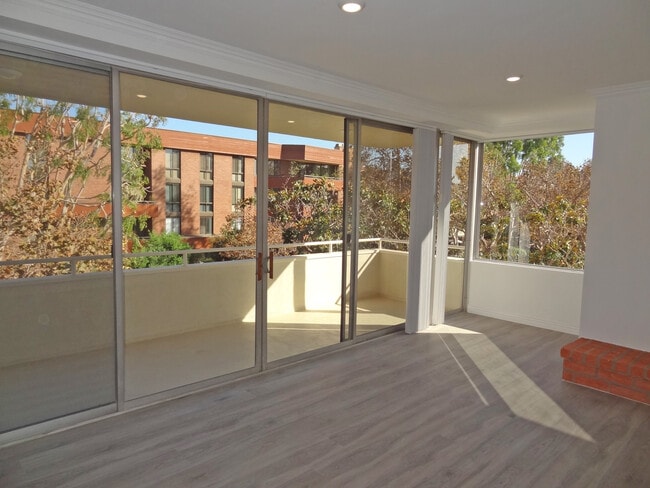 Living Room with Balcony - 303 N Swall Dr