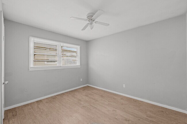 Building Photo - Updated Home with Gorgeous Floors & Large Backyard