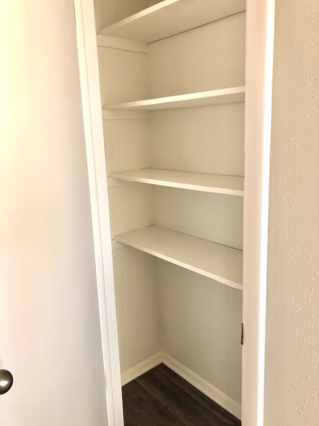 Maximize your storage with this modern built-in shelving unit. - GRACE LANDINGS APARTMENTS