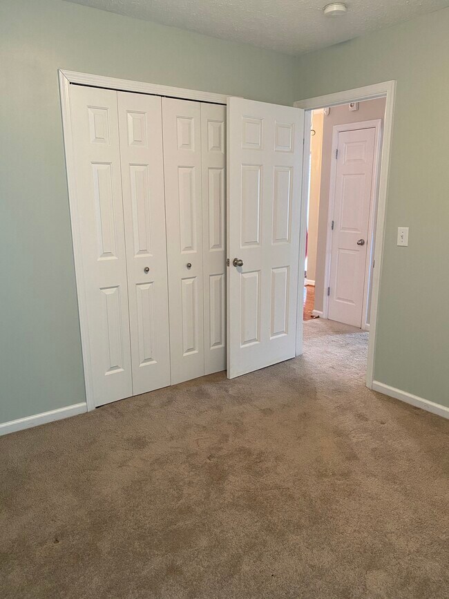 Second bedroom entry and closet - 709 Warmstone Ct