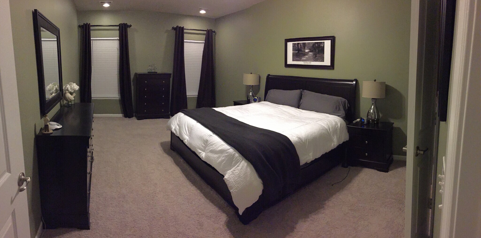 Large master bedroom located on the main level with expanded seating area with overhead lighting - 7736 Tranquil Trl