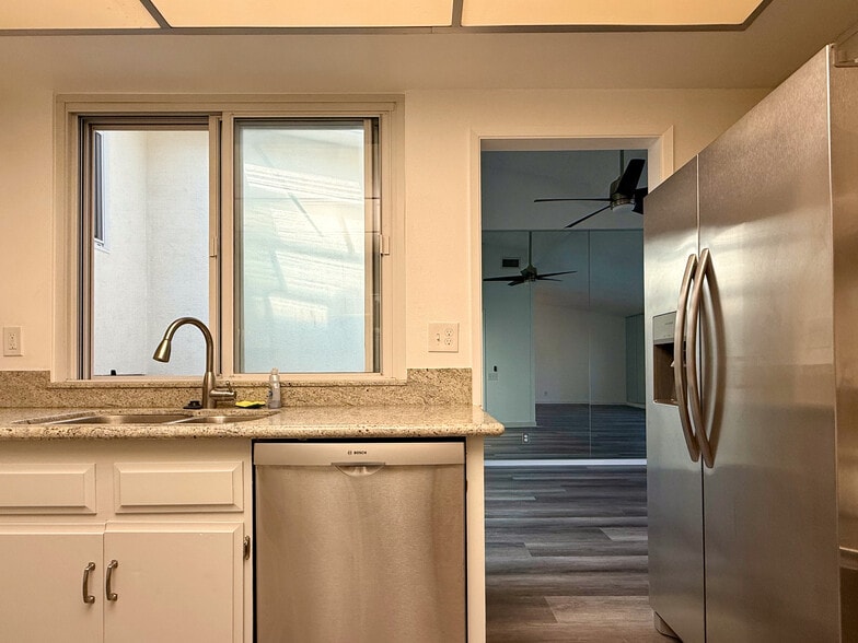 Kitchen with view of sunroom and dining room - 3500 W Manchester Blvd
