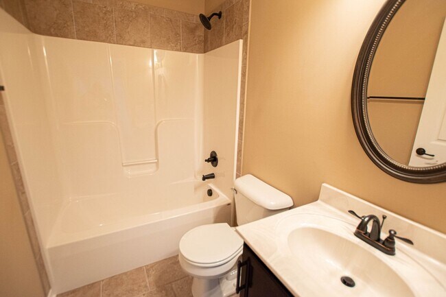 Building Photo - Pet Friendly Three Bedroom with Bonus!