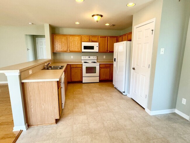 Building Photo - Like New 3 Bedroom & 2 Bath pond front home in Hillsborough! Enjoy the Community Pool, Playground...