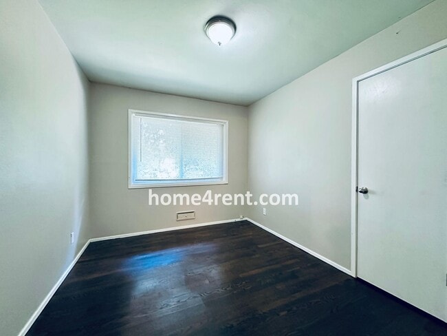 Building Photo - Attractive Prairie Village Ranch w/ FRESH PAINT, Wood Floors, Granite Counters and a Fenced Yard!