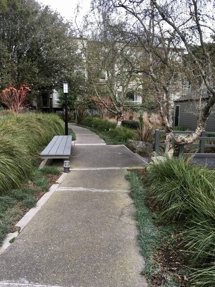 Lush greenery with outdoor benches to enjoy the weather, scenery, ponds and waterfalls - 15 Red Rock Way