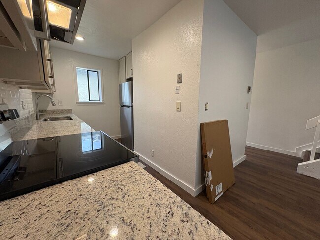 Building Photo - Completely Renovated 2 Bed 1.5 Bath West Pearl Street Condo W/Hiking Trails In Your Backyard.