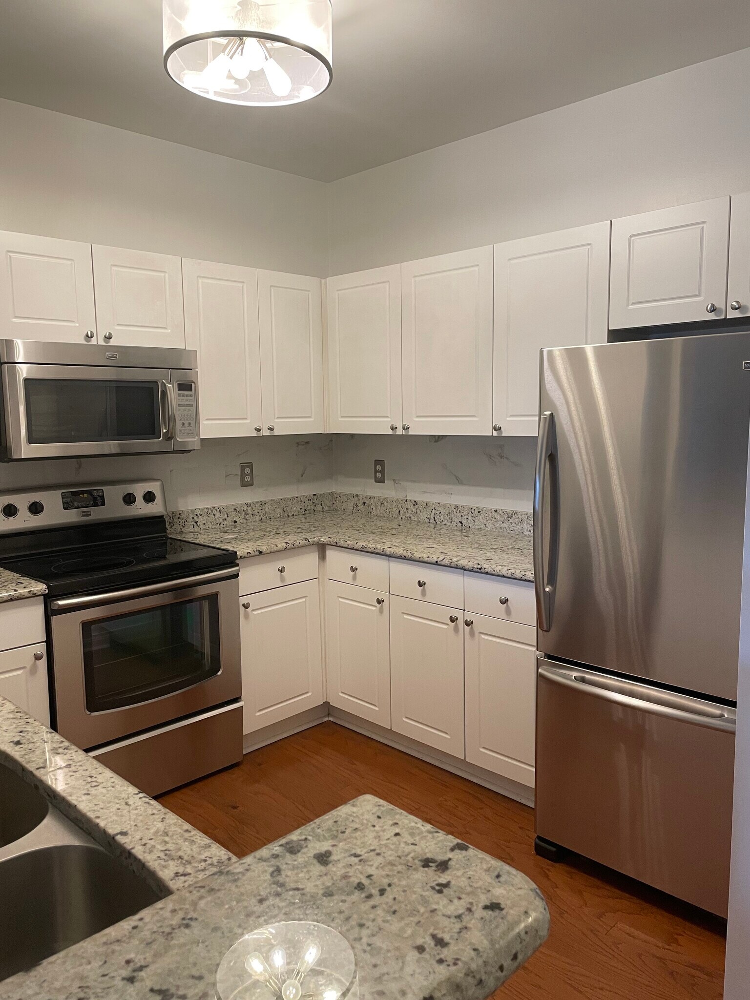 Kitchen with stainless steel appliances - 4551 Strutfield Ln