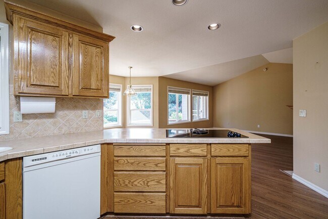 Building Photo - Beautifully Landscaped 1/4 acre with Well Maintained 4 bedroom 2 Bath Home with 3 Car Garage