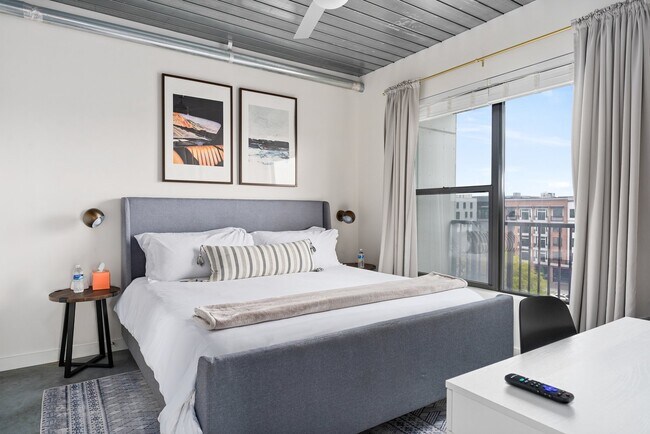 Building Photo - Midtown Magic: Big Savings + Big Perks!