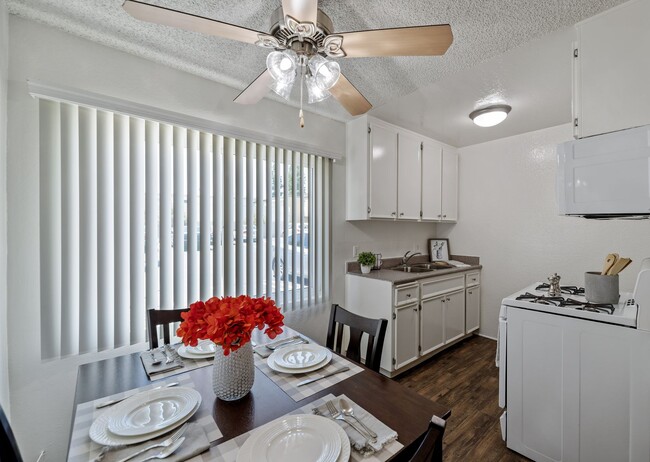 Open concept dining and kitchen with plank flooring in a one bedroom townhome apartment at the Arbor in Studio City, CA - The Arbor