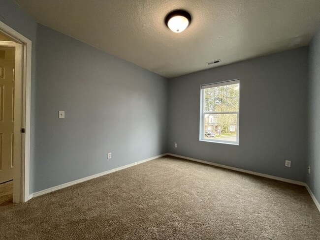 Building Photo - Inviting Two-Story 3BR Home Featuring New Carpet, New Stainless Appliances, Spacious Garage Stora...