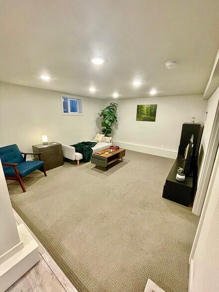Couch folds out into a bed for visitors - 5306 NE 15th Ave