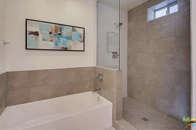 Large primary bathroom with tub and walk in stone shower... - 2080 E McManus Dr