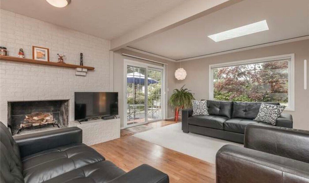 Large living room with a fireplace - 1319 Gemini St SE