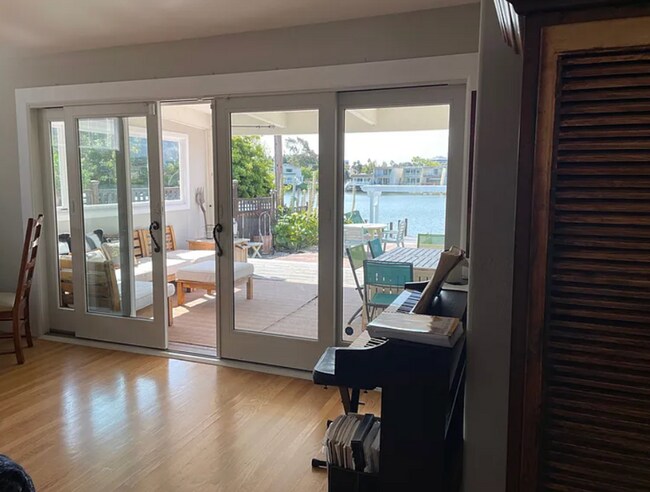 Building Photo - Rare prime waterfront home right on the San Mateo Lagoon, available August 15th!