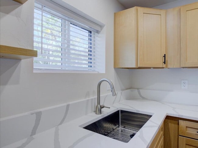 Building Photo - Cozy 2-Bedroom Home with Community Pool & Covered Parking