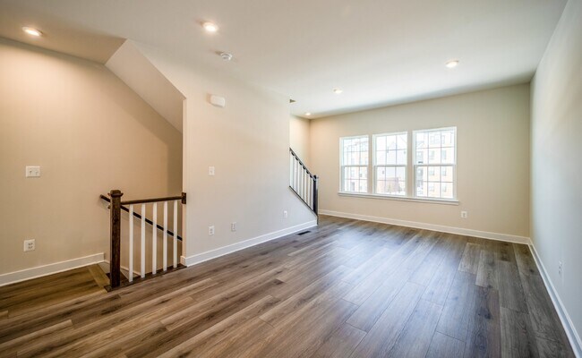 Building Photo - This 3-bedroom, 3-full bathroom townhouse offers a pristine and contemporary living experience.