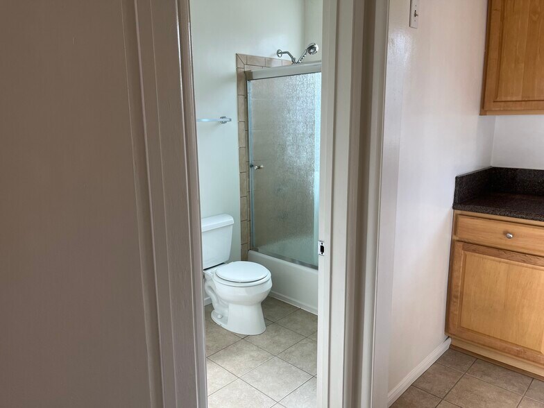 bathroom with entrance from bedroom and kitchen - 1126 E Palmer Ave