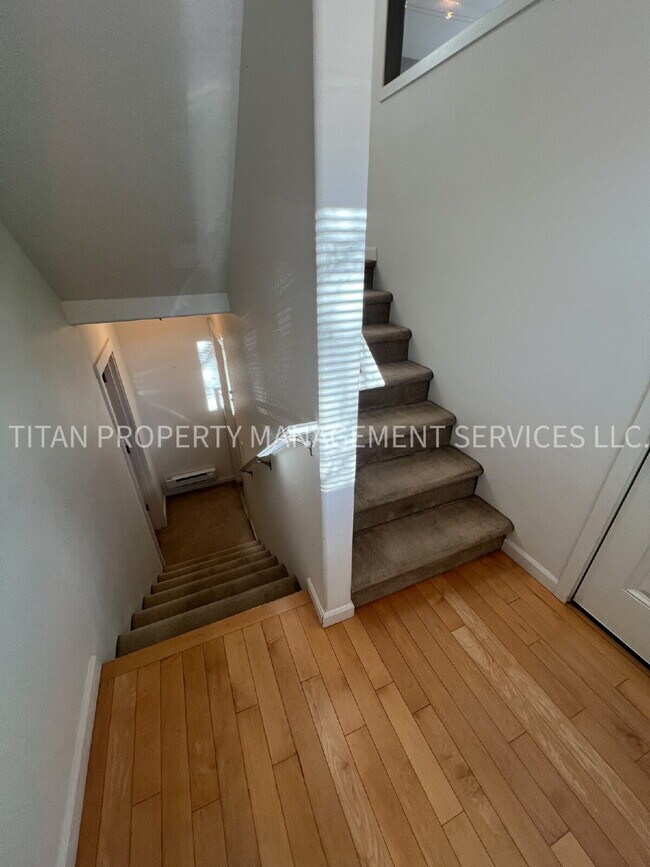 Building Photo - Beautiful Three Story Townhouse with Gas Fireplace, Balcony & 2-Car Garage