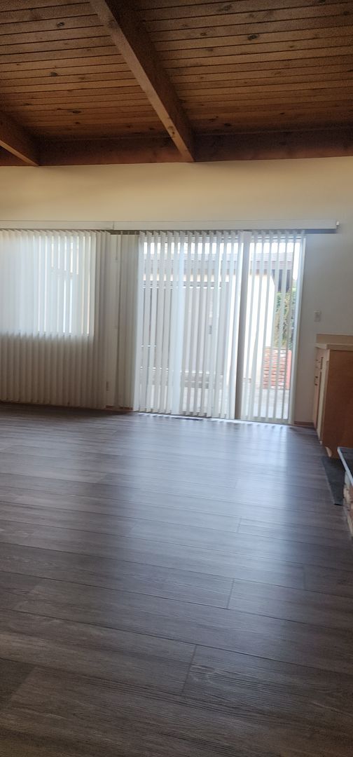 Building Photo - This is a spacious house featuring four bedrooms and two bathrooms, along with a two-car garage.