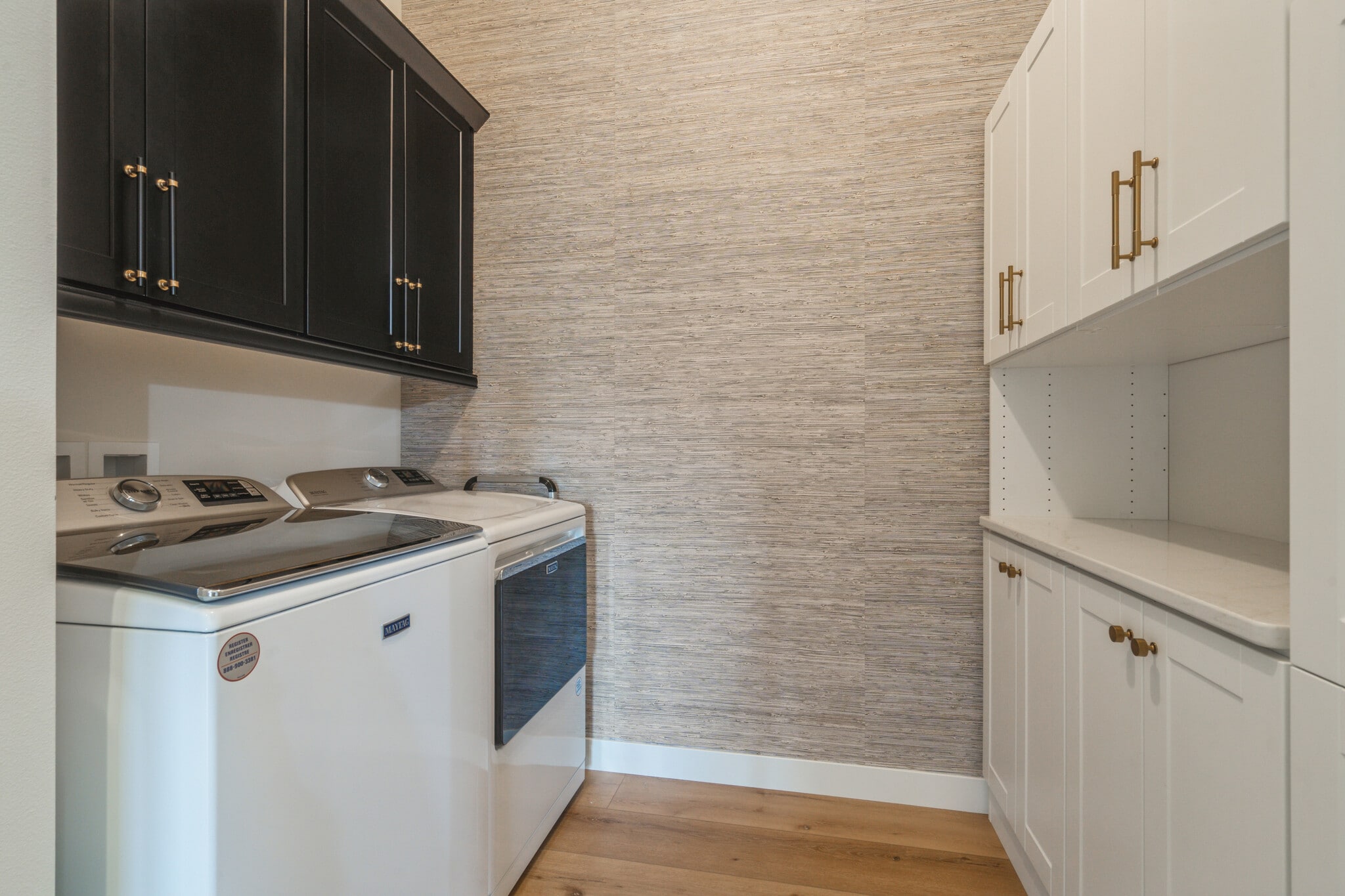 Laundry room with custom cabinetry and wallpaper - 1953 1st Ave SE