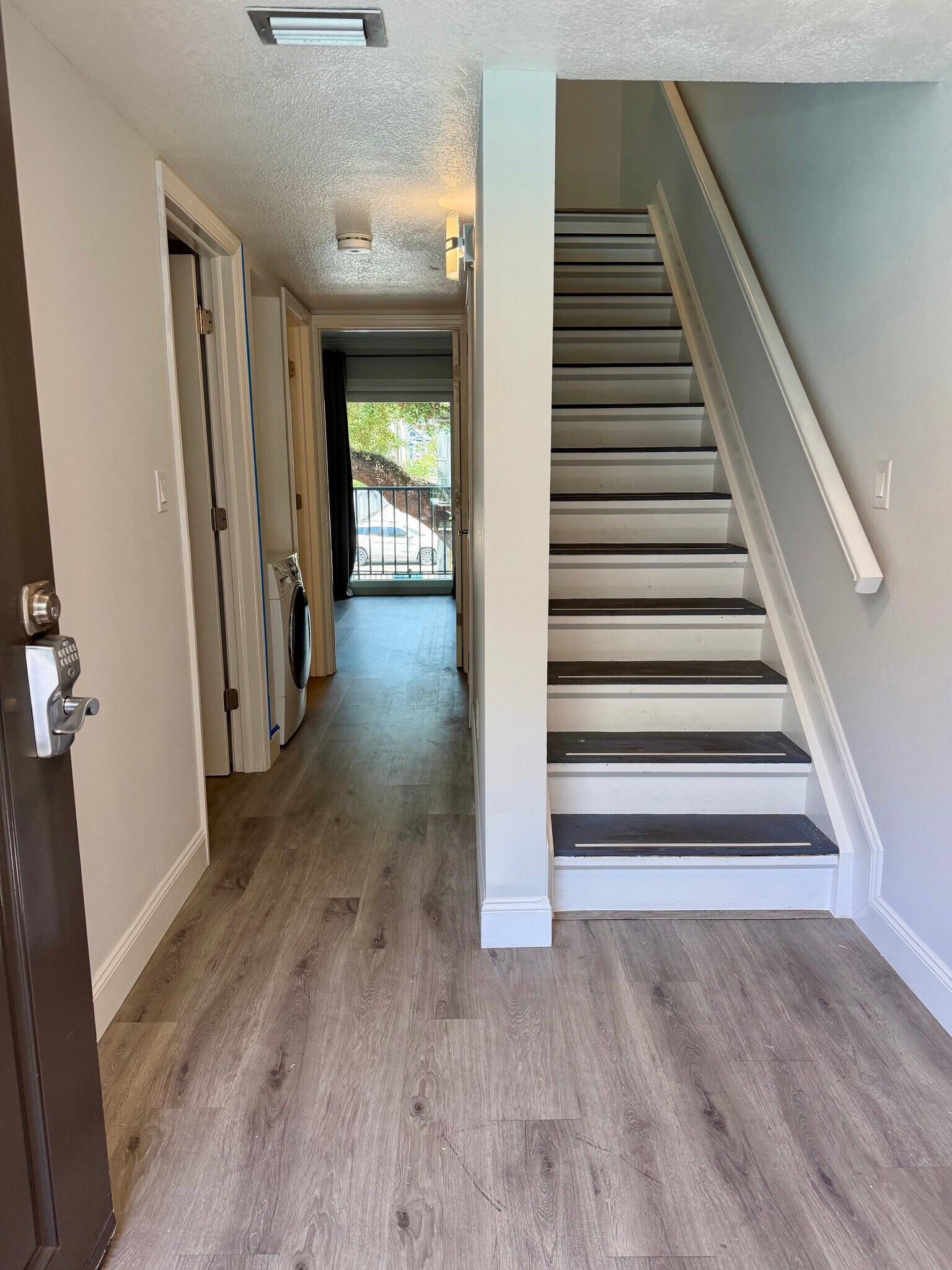 Entry, stairs, and in-unit laundry - 105 4th Ave NE