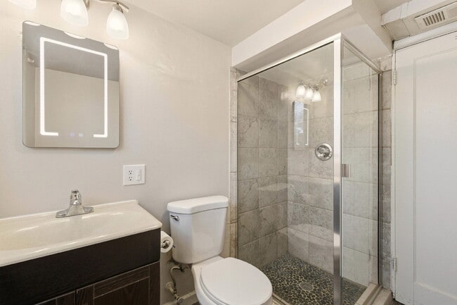 Building Photo - Renovated studio with garage + utilities included! Modern kitchen with island, updated bath, on-s...