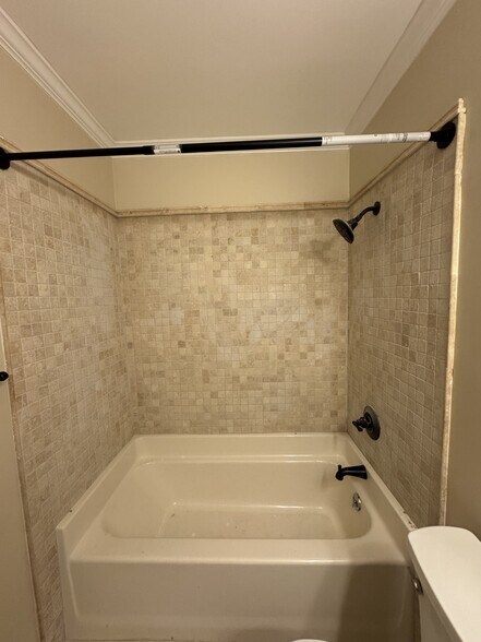 Bathroom 1 - all new tile surround, toilet, vanity, hardware and lighting - 406 Rosa Ave