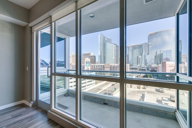 Building Photo - Iconic Strip-View Luxury | Elegant 1BR + Den High-Rise Residence