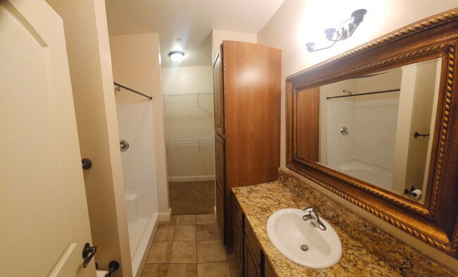 master bedroom bathroom with walk in closet - 4100 Mullan Rd