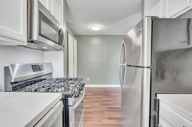 Building Photo - Utilities Included! Updated 2-Bedroom Condo Just Steps from Huntington Metro