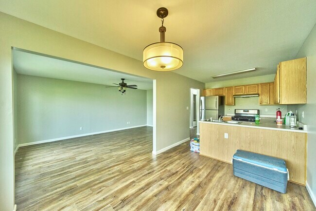 photo of upstairs living room and kitchen from the dining area - 1080 Fairlane Ct