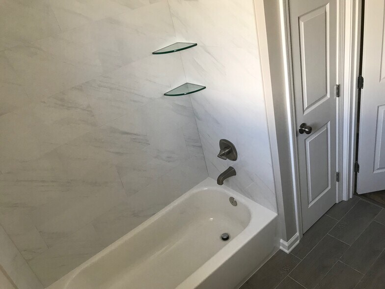 New tub, tile and fixtures - 6216 Roddie St