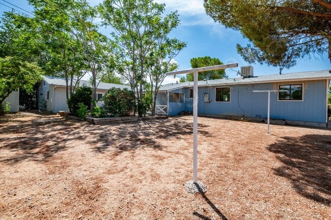 Building Photo - LARGE FENCED YARD WITH DETACHED GARAGE
