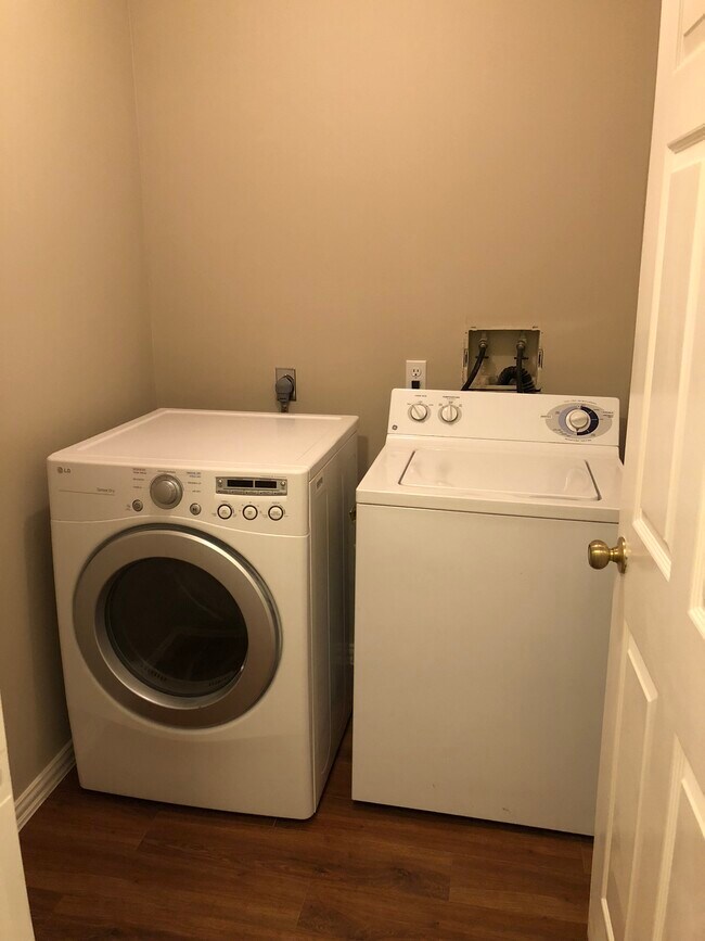 Washer dryer in laundry room of house - 22014 Shady Valley Dr