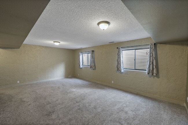 Building Photo - Spacious 4-Bedroom Home with Finished Basement, Large Deck & 2-Car Garage