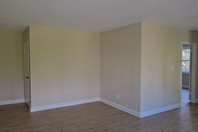 Building Photo - Beautiful corner unit in a secure, all-brick, pet-friendly building