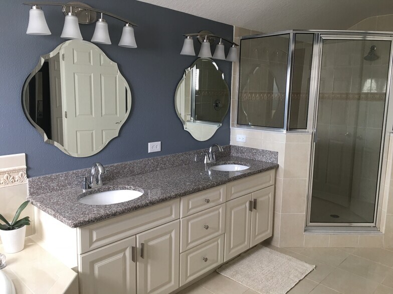 Master bathroom with softclose cabinetry, granite, new sinks/faucets, mirrors, lighting, custom timelwork, and oversized shower - 3103 W Napoleon Ave