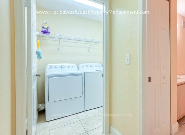 Building Photo - MOVE IN READY! LARGE 2 BEDROOM/2 BATH PLUS ATTACHED GARAGE! TILE/LVP THROUGHOUT!