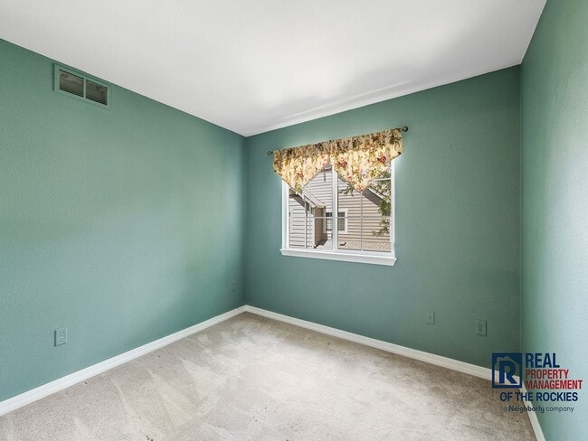 Building Photo - Fort Collins Townhouse with Vaulted Ceilin...