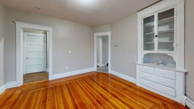 Building Photo - Renovated 6BR with In-Unit Laundry, 3 Parking Spaces & Commuter Rail Access