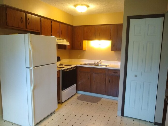 Kitchen with refrigerator and stove - 2378 Zircon St NE