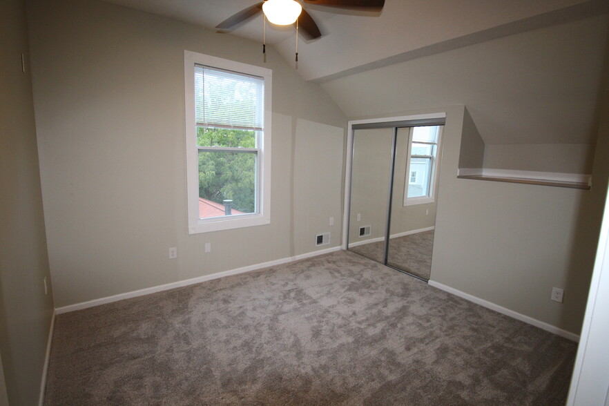 Bedroom #2 has a lofty high ceiling, ceiling fan, and huge walk in closet - 4536 Leo Street