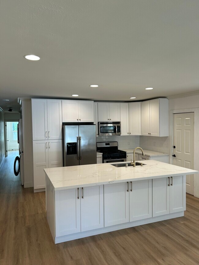 Kitchen includes microwave, stove, dishwasher, fridge with water and ice dispenser - 1139 S Highland Ave