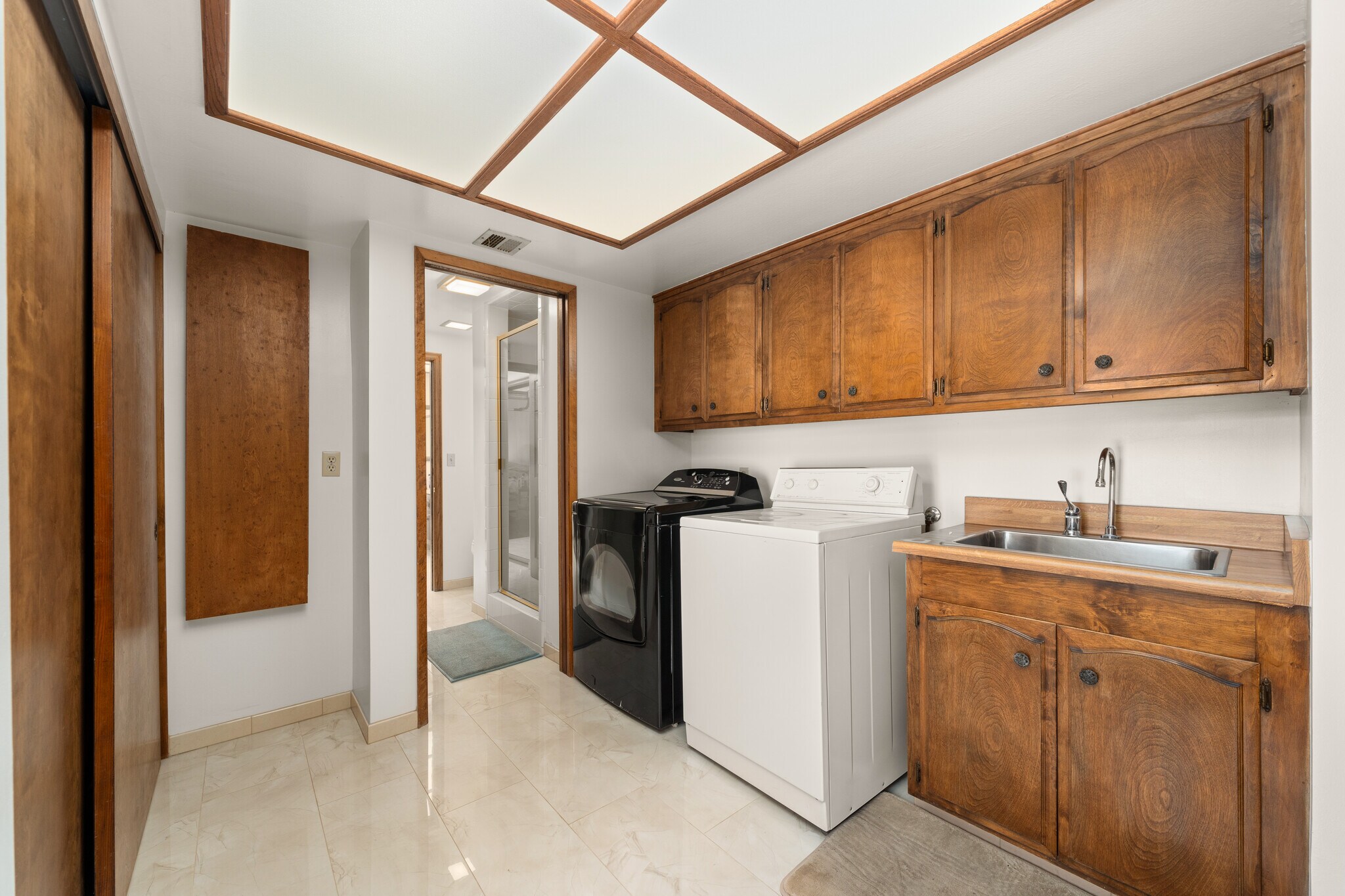 Large Laundry room with full cabinets storage & marble floor Large Sink, Electrical Iron board - 1557 E Puente St