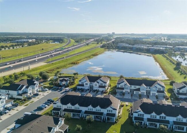 Building Photo - Immaculate Townhome · Dual En-Suite Bedrooms + Flex Loft · Cable & Internet Included · 3.5 Miles ...