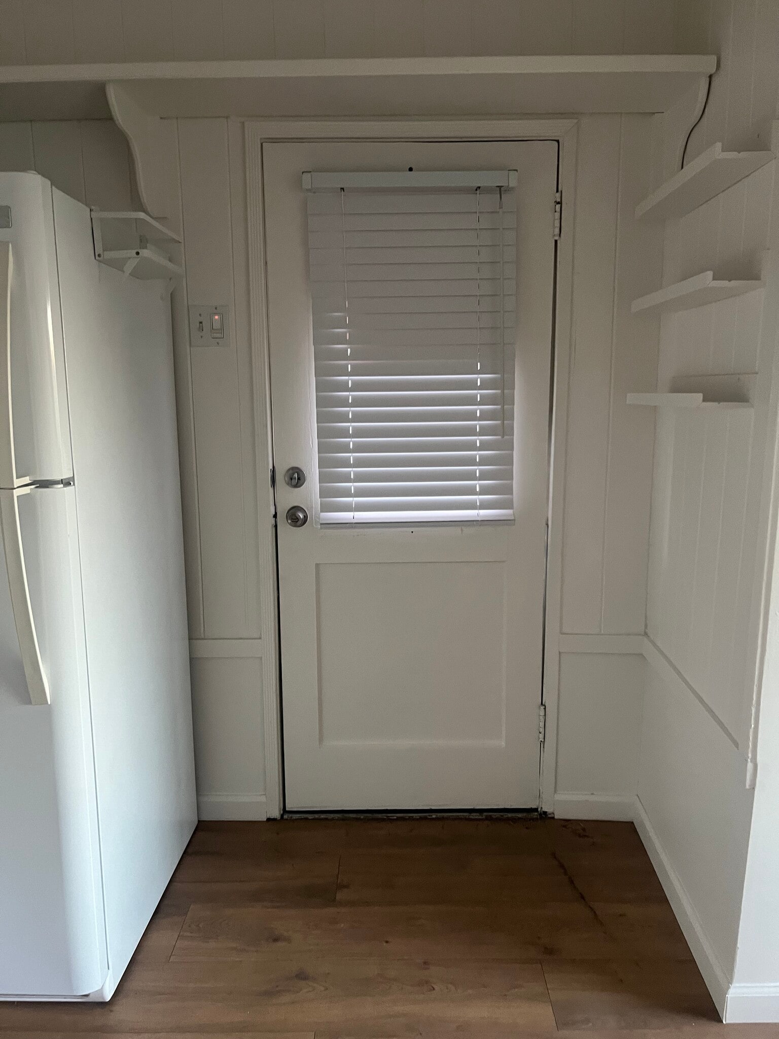 Inside view of front door with adjustable blinds - 15138 Encanto Dr